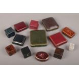 Thirteen Victorian and later tooled leather and paper faux coverings jewellery boxes and cases.