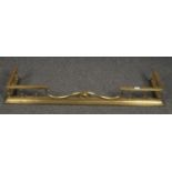 A Victorian brass fire fender, 130cm wide.