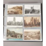 An album of vintage postcards, Whitby, Flamborough examples.