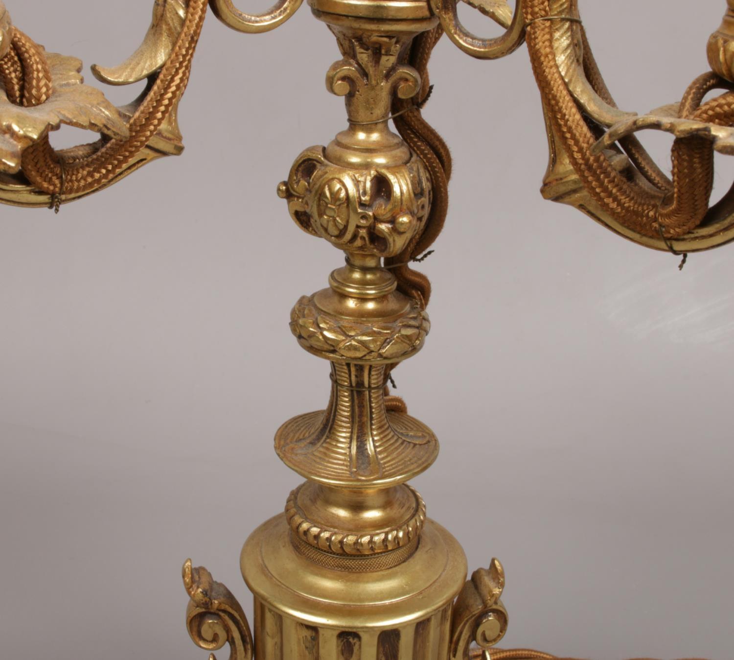 A French gilt bronze three branch tablelamp. With leaf moulded sconces and raised on a column plinth - Image 4 of 5