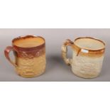 Two c19th salt glazed stoneware porters tankards with sprig moulded decoration depicting stag