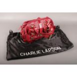 A red leather Charlie Lapson, with snake skin effect detail.(With dust bag). Good condition.