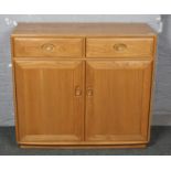 A golden dawn Ercol two drawer sideboard. Good condition.