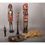 A collection of wooden decorative figurines to include wooden tribal mask