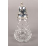 A silver top cut glass sugar caster, assayed Birmingham 1980.