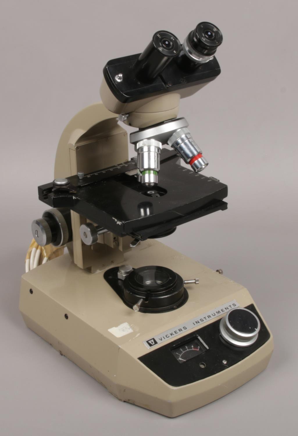 A Vickers instruments electric binocular microscope.