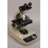 A Vickers instruments electric binocular microscope.