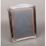 A George V silver mounted easel photograph frame with oak back by A & J Zimmerman Ltd (Arthur & John