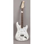 A Chord electric guitar after a Fender Stratocaster original autographed by various musician from
