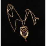 A 9ct gold Art Nouveau style garnet and pearl pendant on chain, 2.67 grams. Good condition.
