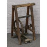 A vintage foot operated treadle belt drive.