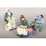 Three Royal Doulton ceramic figurines to include The rag doll seller example etc.