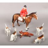 A collection of Beswick ceramic figurines to include Huntsman, hounds and fox.
