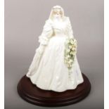 A limited edition Coalport figurine of Diana princess of wales 29th of July 1981 in her wedding