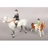 Two Beswick figures of horse riders to include child example.