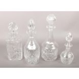 Four cut glass decanters.