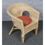 A wicker child's armchair, 52cm tall.