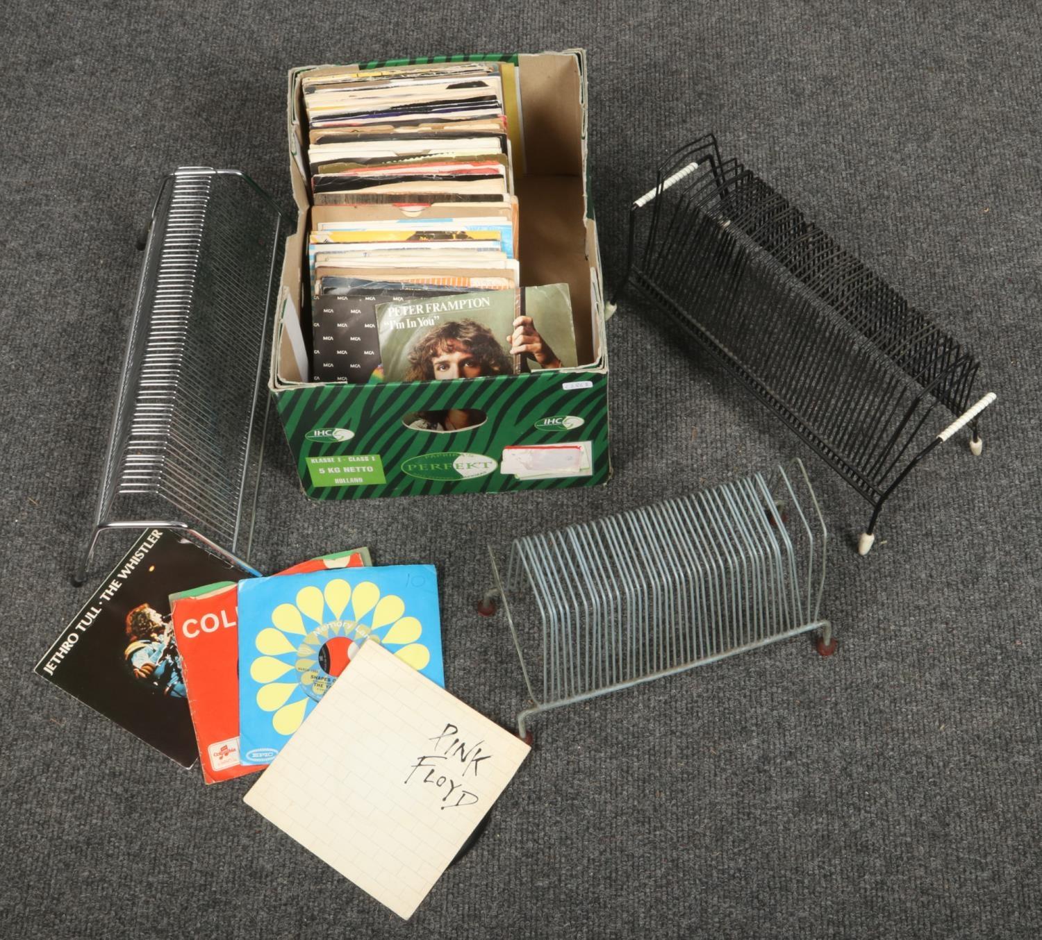 A box of Rock single records, to include The Rolling Stones, Pink Floyd, Guns N' Roses etc. along