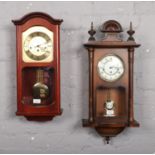 Two modern wall clocks, one by Woodford, the other Anstey & Wilson.