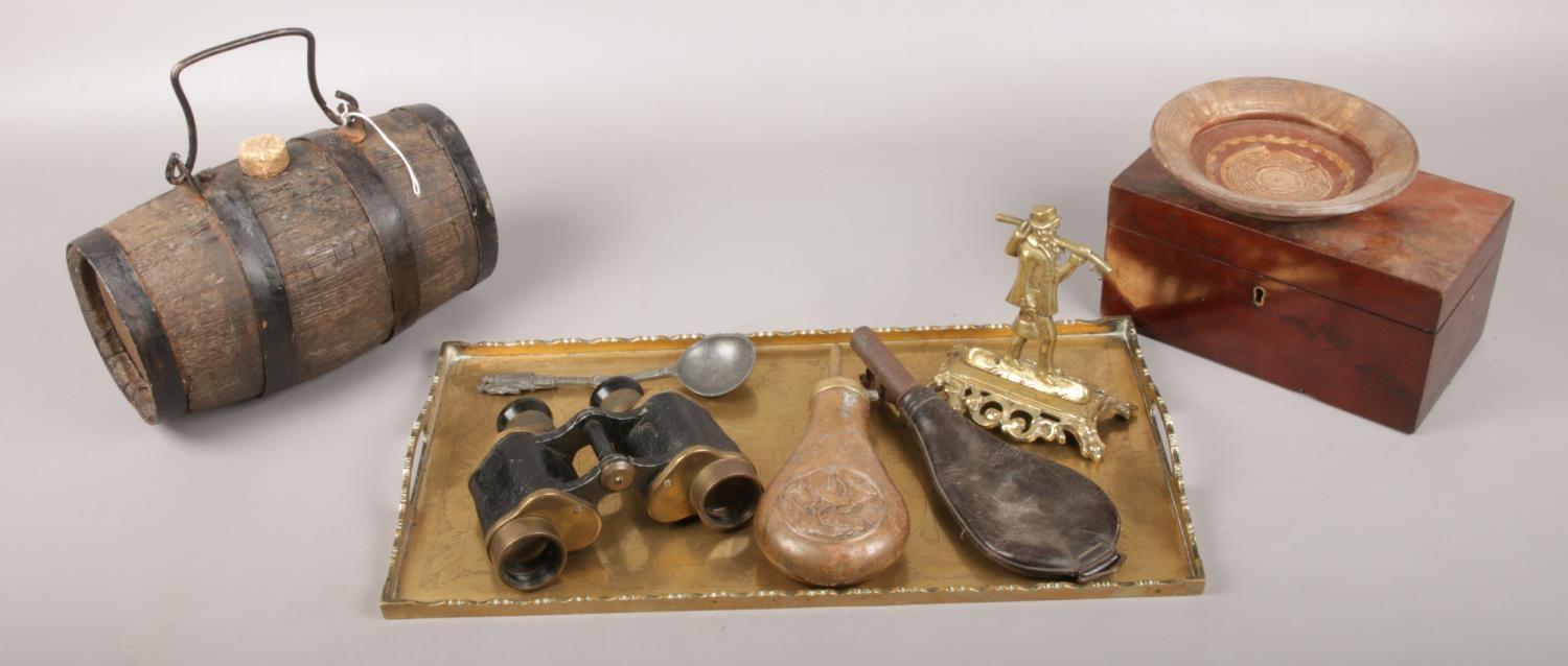 A group lot of collectables to include powder flasks, binoculars, brass tray etc.