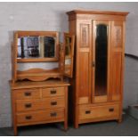 A Victorian satinwood two part bedroom suite to include wardrobe and dressing table. Door of the