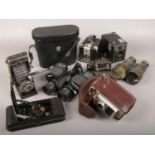 A box of cameras and binoculars, to include Agfa bellows camera, Brownie box camera, Miranda