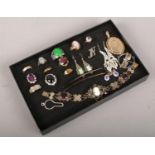 A display case of costume jewellery to include dress rings, earrings, bracelet etc. Filigree