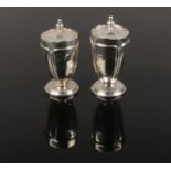 Two George V Art Nouveau style silver salt and pepper shakers by Mappin & Webb. Assayed Birmingham