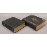 Two leather bound family bibles with coloured plates.