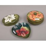 Three pieces of Moorcroft in the Hibiscus design to include potpourri pot, trinket box and a dish.