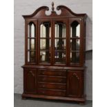 A mahogany mirror back display cabinet.