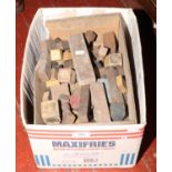 A box of vintage wooden building blocks.