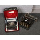 An imperial typewriter along with another cased typewriter.