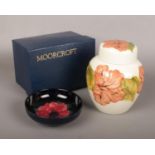A boxed Moorcroft ginger jar and cover, cream ground and decorated in the Hibiscus pattern along