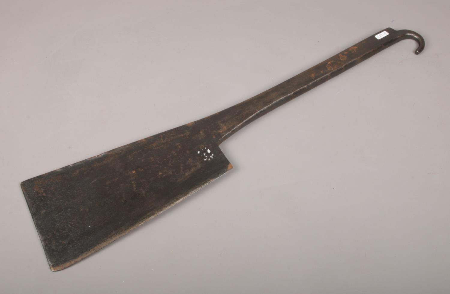 A large 19th century wrought iron cleaver. (Length 71cm).