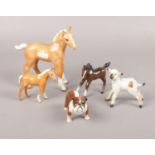 A collection of Beswick animal figures, horse, foals, lamb and bulldog Good.