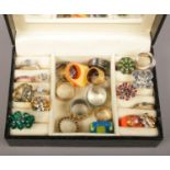 A jewellery box containing 26 assorted dress rings.