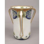 A James Macintyre & Co. Florian ware three handled vase designed by William Moorcroft. With gilt rim