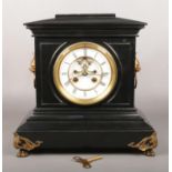 A Victorian slate mantel clock. With enamel dial having visible anchor escapement. With gilt metal