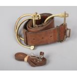A World War I leather belt and three brass kit clasps. Good condition.