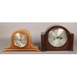 A carved oak Enfield mantle clock, along with a Garrard Clocks Ltd mantle clock, both with