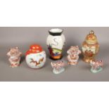 A group of oriental style ceramic's, frog figures, Rhino figures, jars, vases
