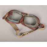 A pair of World War II RAF pilots goggles mk8, with original strap bearing pilots number, Very