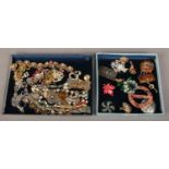 Two trays of vintage costume jewellery brooches.
