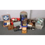 Four boxes of miscellaneous to include wicker picnic hamper, crested ware, metal wares, wall mirror,