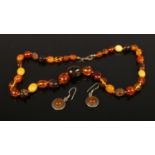 A mixed graduated amber bead necklace including butterscotch and a pair cabochon earrings.