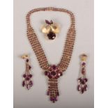 A vintage amethyst effect and gilt metal suite of jewellery including necklet, brooch and earrings.