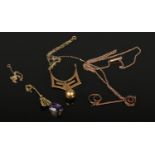 Three 9ct gold pendants and necklaces including amethyst and garnet. 7.94 grams gross. With some