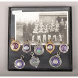 Eight football medals, including four silver examples, purportedly won by Ernest Puckeridge (see