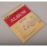 An album containing a full set of 60 A&BC chewing gum The Beatles picture cards.